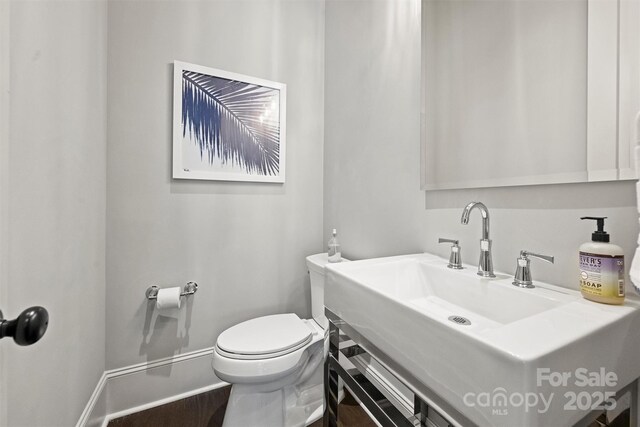 622 Mattie Rose Ln, Charlotte, NC 28204 - half bathroom with wood finished floors and vanity