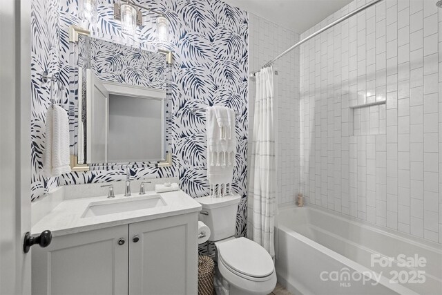 622 Mattie Rose Ln, Charlotte, NC 28204 - bathroom with wallpapered walls, vanity, and shower / bath combo with shower curtain