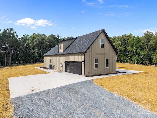 5507 NC-218 Hwy, Peachland, NC 28133 - view of property exterior featuring concrete driveway, an attached garage, a yard, board and batten siding, and roof with shingles