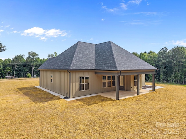 5507 NC-218 Hwy, Peachland, NC 28133 - rear view of house featuring a shingled roof, a patio area, and a yard