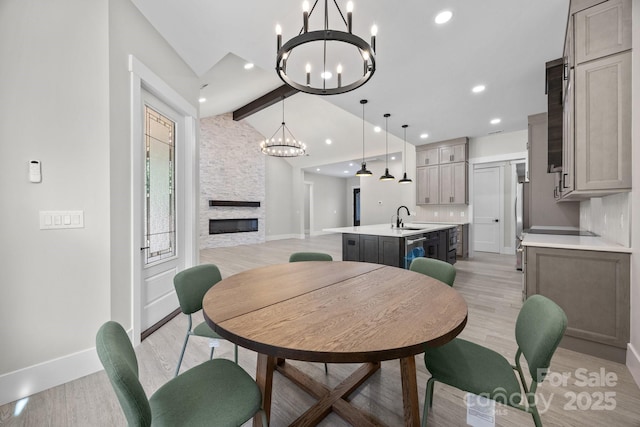 5507 NC-218 Hwy, Peachland, NC 28133 - dining area with a chandelier, light wood finished floors, a fireplace, and recessed lighting
