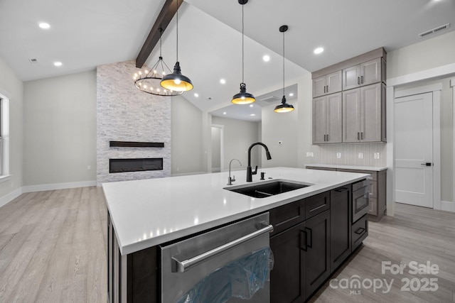 5507 NC-218 Hwy, Peachland, NC 28133 - kitchen with stainless steel appliances, light wood finished floors, light countertops, a kitchen island with sink, and recessed lighting