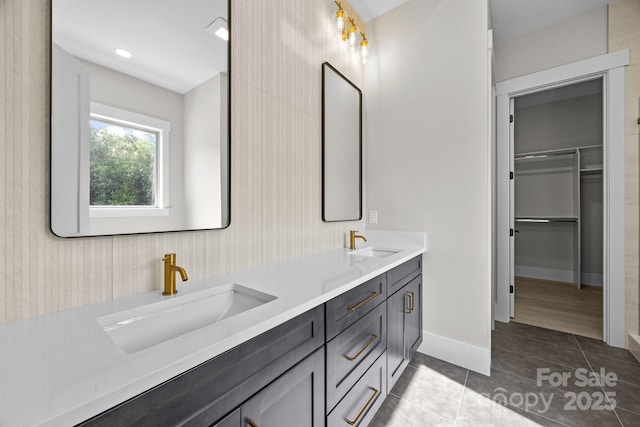 5507 NC-218 Hwy, Peachland, NC 28133 - full bathroom featuring double vanity, tile patterned flooring, and a walk in closet
