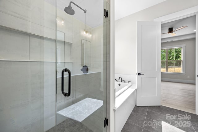 5507 NC-218 Hwy, Peachland, NC 28133 - full bathroom featuring a bath, a shower stall, a ceiling fan, and tile patterned floors