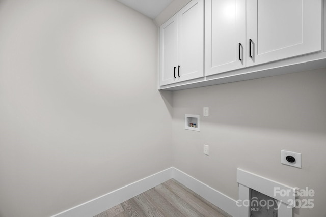 5507 NC-218 Hwy, Peachland, NC 28133 - washroom featuring hookup for an electric dryer, cabinet space, light wood finished floors, and hookup for a washing machine