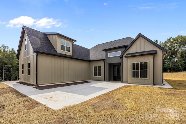 5507 NC-218 Hwy, Peachland, NC 28133 - modern farmhouse style home with a patio, a shingled roof, and board and batten siding