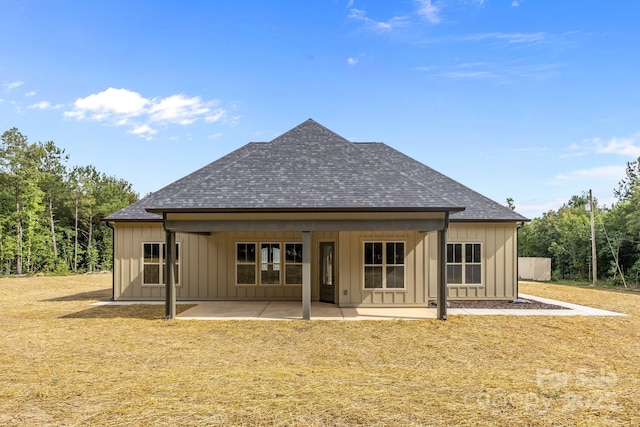 5507 NC-218 Hwy, Peachland, NC 28133 - rear view of property with a shingled roof, board and batten siding, a patio area, and a yard
