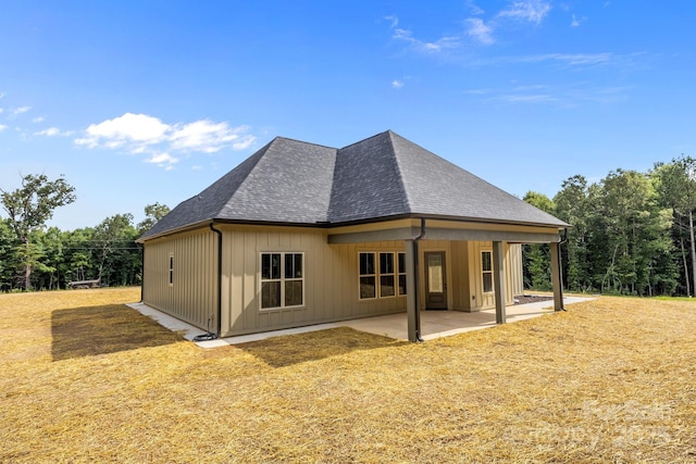 5507 NC-218 Hwy, Peachland, NC 28133 - back of property featuring a patio, a shingled roof, and a lawn