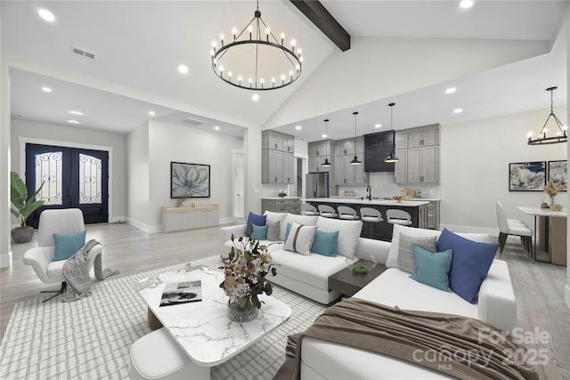 5507 NC-218 Hwy, Peachland, NC 28133 - living room with a chandelier, light wood finished floors, recessed lighting, beam ceiling, and high vaulted ceiling