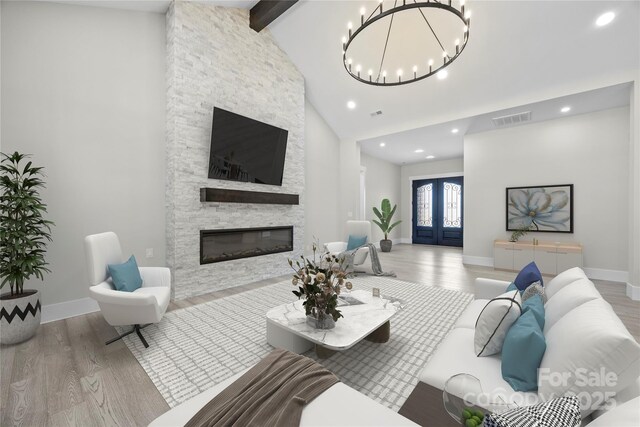 5507 NC-218 Hwy, Peachland, NC 28133 - living room with wood finished floors, a chandelier, a stone fireplace, and recessed lighting
