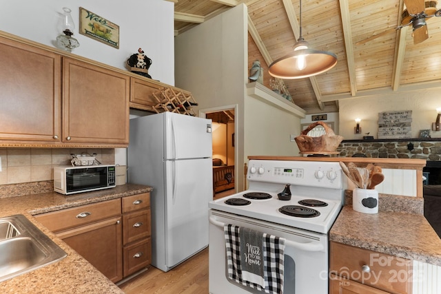 80 Laurel Canyon Rd, Franklin, NC 28734 - kitchen featuring white appliances, wooden ceiling, brown cabinets, light wood-type flooring, and tasteful backsplash