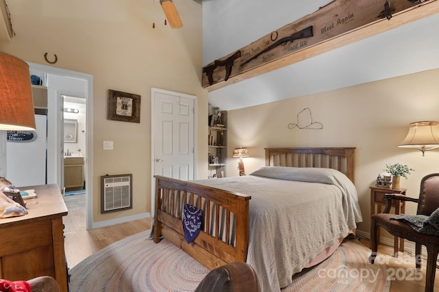 80 Laurel Canyon Rd, Franklin, NC 28734 - bedroom featuring heating unit, light wood finished floors, and ensuite bathroom