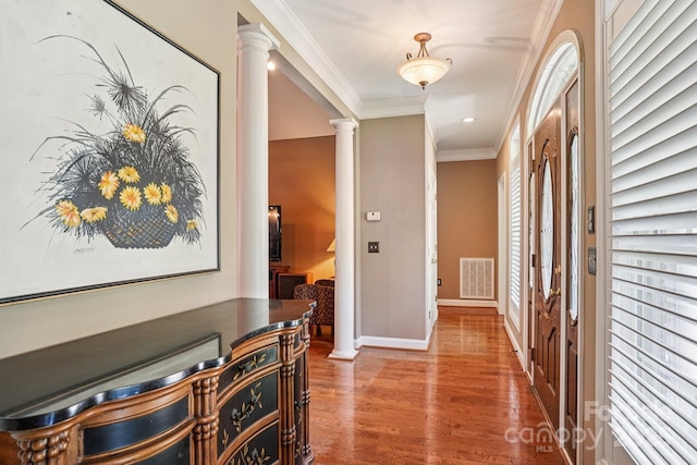 7612 Maple Bluff Ln, Concord, NC 28025 - hall featuring ornate columns, wood finished floors, and crown molding
