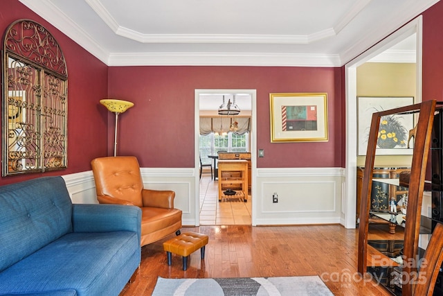 7612 Maple Bluff Ln, Concord, NC 28025 - living area featuring hardwood / wood-style floors, ornamental molding, and wainscoting