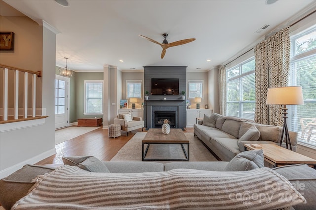 5256 Meadowcroft Way, Fort Mill, SC 29708 - living area featuring wood finished floors, a ceiling fan, a large fireplace, ornamental molding, and recessed lighting