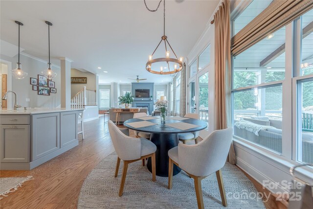 5256 Meadowcroft Way, Fort Mill, SC 29708 - dining room featuring a chandelier, light wood-type flooring, crown molding, and recessed lighting
