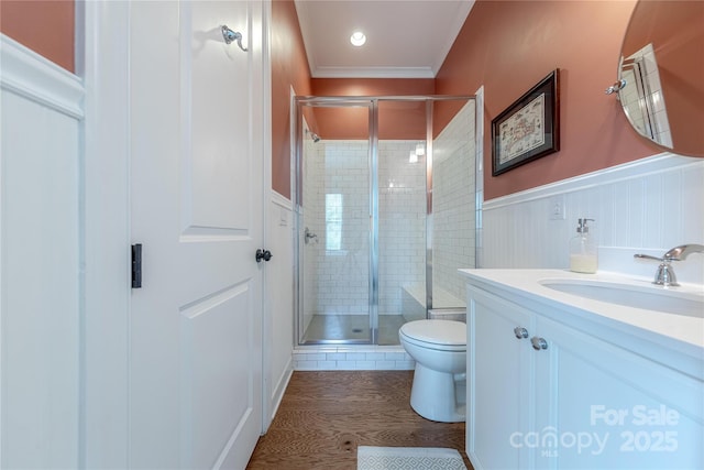 5256 Meadowcroft Way, Fort Mill, SC 29708 - full bathroom with vanity, a stall shower, a wainscoted wall, wood finished floors, and ornamental molding