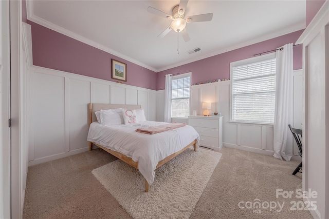 5256 Meadowcroft Way, Fort Mill, SC 29708 - bedroom featuring a decorative wall, light carpet, ornamental molding, wainscoting, and ceiling fan