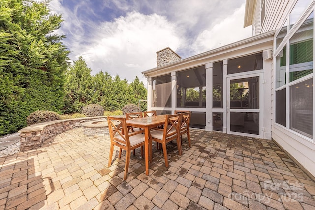 5256 Meadowcroft Way, Fort Mill, SC 29708 - view of patio featuring a sunroom, outdoor dining area, and an outdoor fire pit