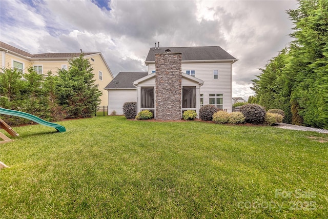 5256 Meadowcroft Way, Fort Mill, SC 29708 - back of house with a yard, a sunroom, and a playground