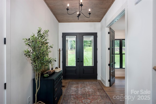 176 Windwood Ln, Troutman, NC 28166 - entryway featuring french doors, wood finished floors, wood ceiling, and a chandelier