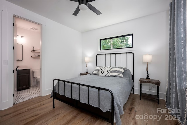 176 Windwood Ln, Troutman, NC 28166 - bedroom featuring wood finished floors, ensuite bathroom, and ceiling fan