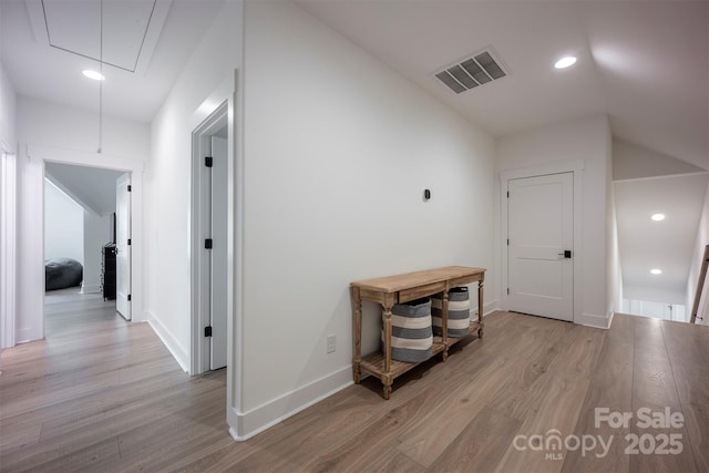 176 Windwood Ln, Troutman, NC 28166 - hallway with attic access, light wood-style floors, lofted ceiling, and recessed lighting