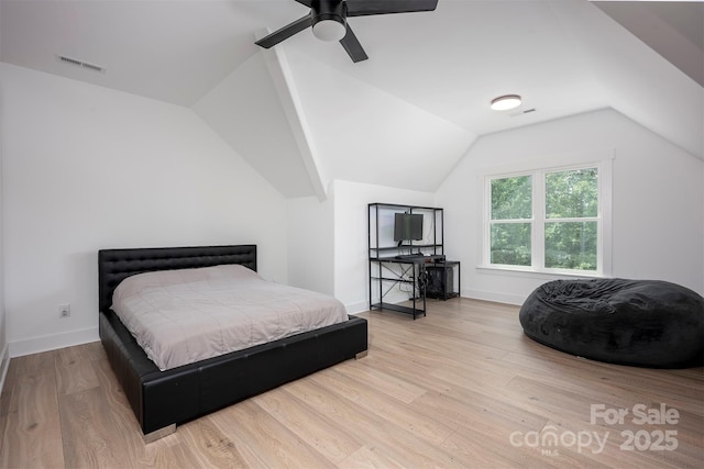 176 Windwood Ln, Troutman, NC 28166 - bedroom with wood finished floors, vaulted ceiling, and a ceiling fan
