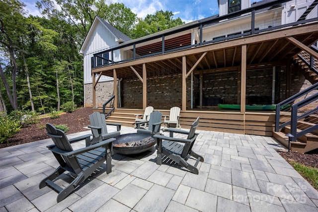 176 Windwood Ln, Troutman, NC 28166 - view of patio with stairway, a fire pit, and a deck