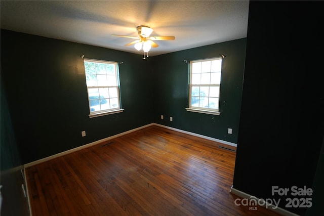 201 W 19th St, Kannapolis, NC 28081 - empty room featuring wood-type flooring and a ceiling fan
