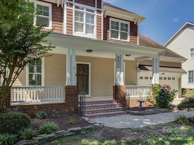 8508 Sandowne Ln, Huntersville, NC 28078 - view of front facade with covered porch and an attached garage