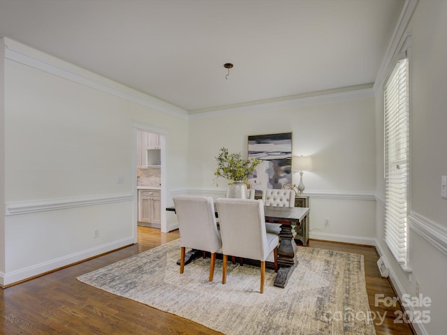 8508 Sandowne Ln, Huntersville, NC 28078 - dining area featuring healthy amount of natural light, wood finished floors, and crown molding