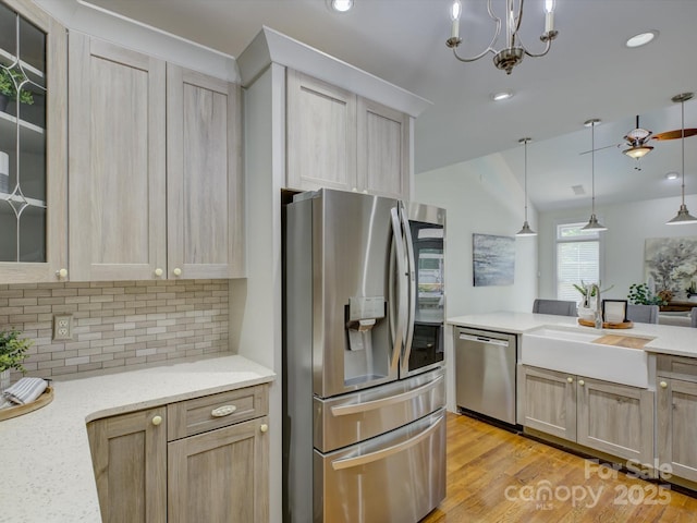 8508 Sandowne Ln, Huntersville, NC 28078 - kitchen with stainless steel appliances, decorative backsplash, light brown cabinets, glass insert cabinets, and recessed lighting