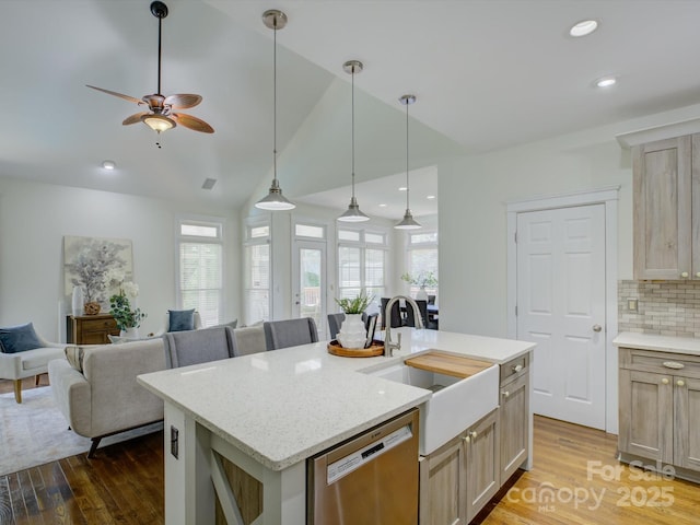 8508 Sandowne Ln, Huntersville, NC 28078 - kitchen with stainless steel dishwasher, wood finished floors, open floor plan, a kitchen island with sink, and vaulted ceiling