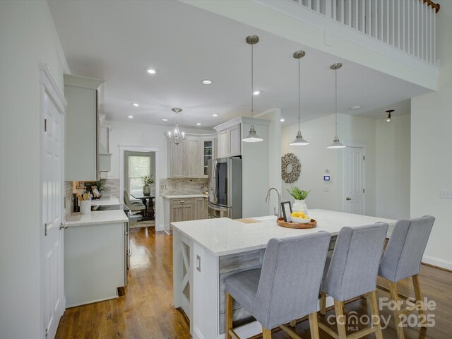 8508 Sandowne Ln, Huntersville, NC 28078 - kitchen featuring smart refrigerator, decorative backsplash, recessed lighting, a breakfast bar, and dark wood finished floors