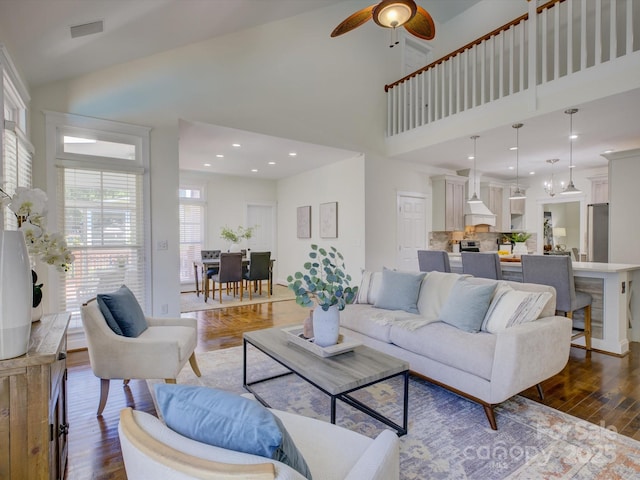 8508 Sandowne Ln, Huntersville, NC 28078 - living area with high vaulted ceiling, a ceiling fan, and dark wood-style floors