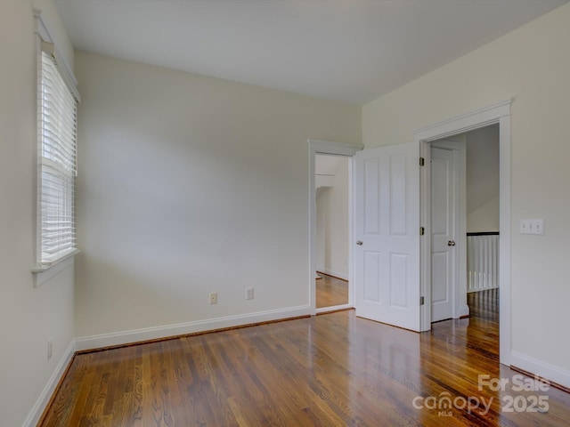 8508 Sandowne Ln, Huntersville, NC 28078 - unfurnished bedroom featuring wood finished floors and baseboards