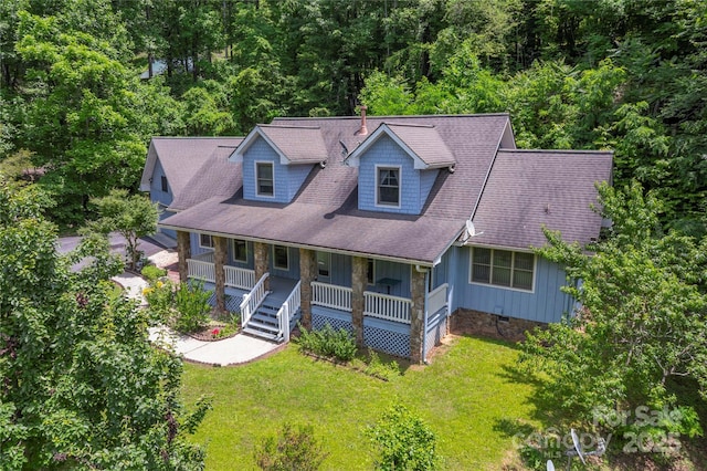 98 Choga Rdg, Whittier, NC 28789 - cape cod house with board and batten siding, a porch, a front yard, and a view of trees