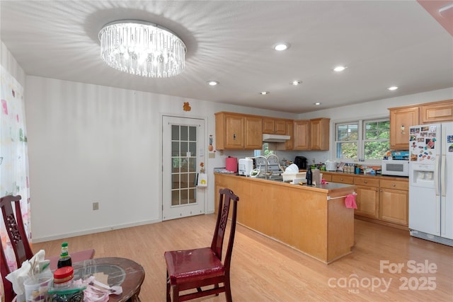 98 Choga Rdg, Whittier, NC 28789 - kitchen with white appliances, light wood-style floors, under cabinet range hood, recessed lighting, and a chandelier