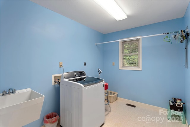98 Choga Rdg, Whittier, NC 28789 - washroom featuring washer / clothes dryer and tile patterned floors