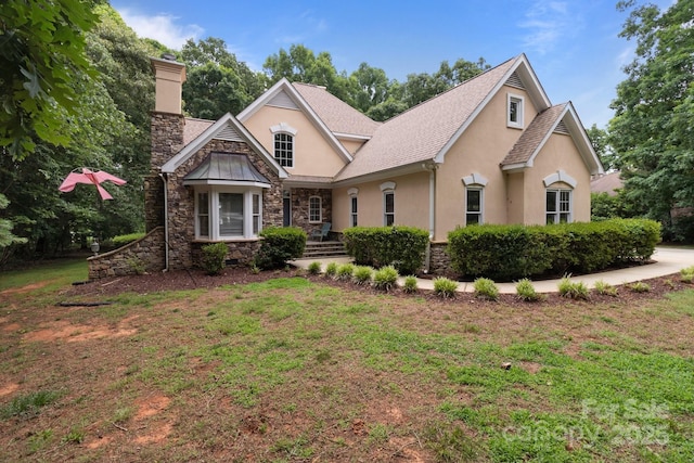 165 Futrell Lndg, New London, NC 28127 - view of front of property with stucco siding, stone siding, a chimney, a front yard, and a shingled roof