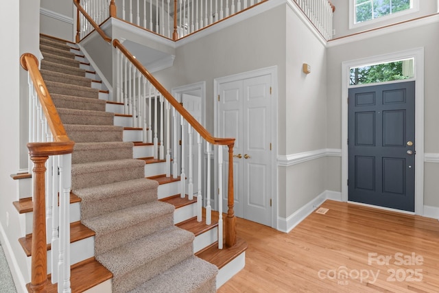 165 Futrell Lndg, New London, NC 28127 - entryway with stairs, a towering ceiling, and wood finished floors