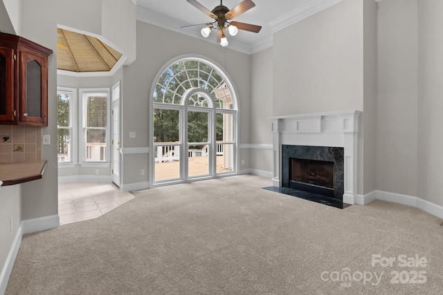 165 Futrell Lndg, New London, NC 28127 - unfurnished living room featuring light carpet, crown molding, a ceiling fan, and a premium fireplace
