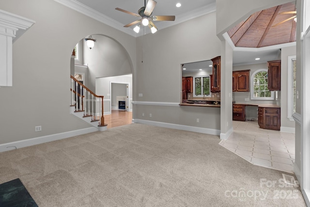 165 Futrell Lndg, New London, NC 28127 - unfurnished living room with light colored carpet, a ceiling fan, crown molding, recessed lighting, and stairway