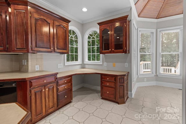 165 Futrell Lndg, New London, NC 28127 - kitchen featuring built in study area, light countertops, recessed lighting, tasteful backsplash, and crown molding