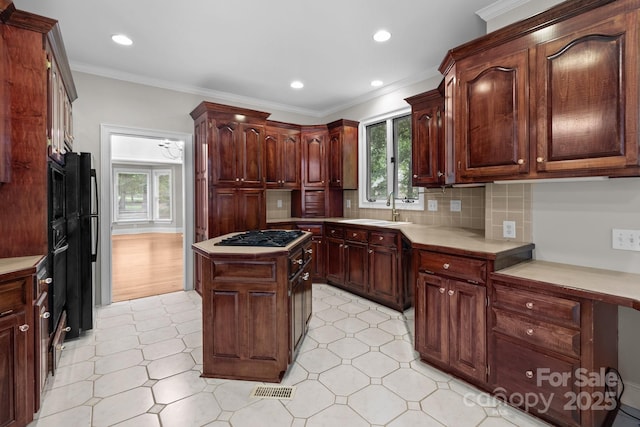 165 Futrell Lndg, New London, NC 28127 - kitchen with gas cooktop, healthy amount of natural light, light countertops, a center island, and recessed lighting