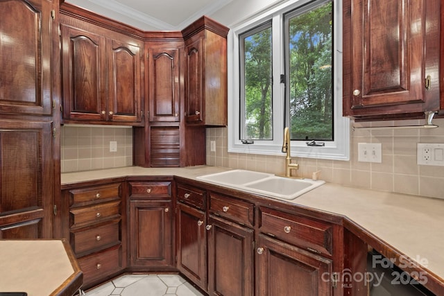 165 Futrell Lndg, New London, NC 28127 - kitchen with light countertops, healthy amount of natural light, ornamental molding, and tasteful backsplash
