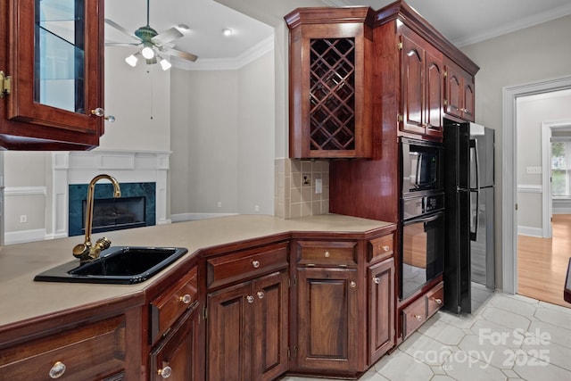 165 Futrell Lndg, New London, NC 28127 - kitchen featuring black appliances, light countertops, crown molding, light tile patterned flooring, and a ceiling fan