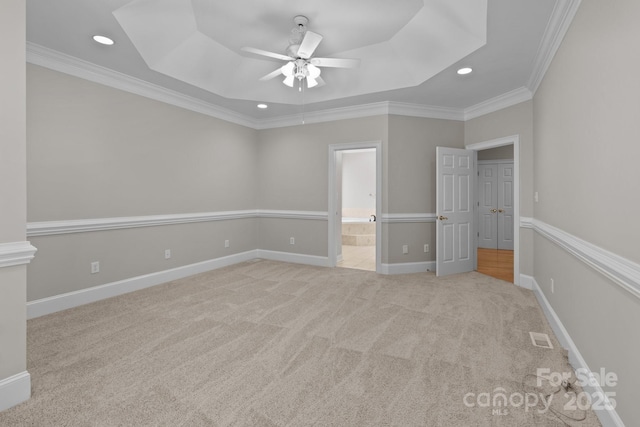 165 Futrell Lndg, New London, NC 28127 - unfurnished bedroom with a tray ceiling, recessed lighting, ornamental molding, carpet flooring, and ensuite bath