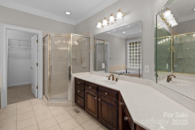 165 Futrell Lndg, New London, NC 28127 - bathroom featuring vanity, a shower stall, tile patterned floors, a walk in closet, and ornamental molding